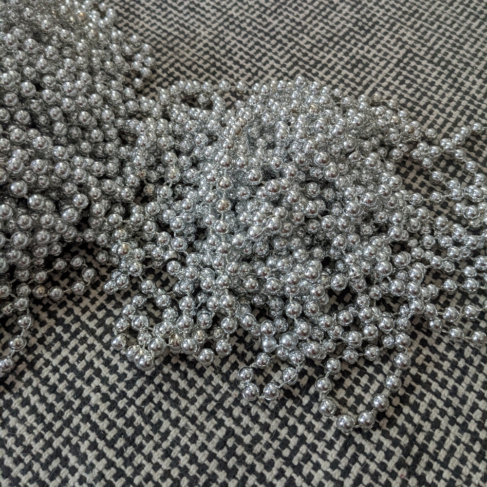 Silver Mardi gras beads